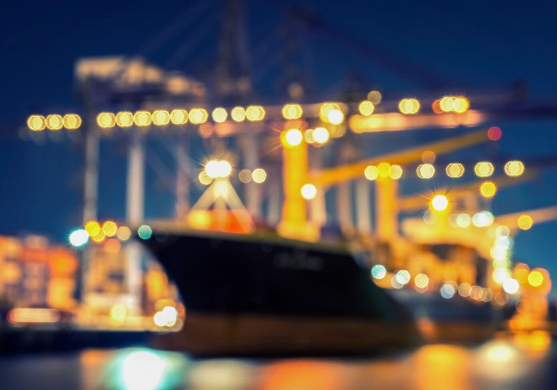 Blurred cargo ship and port lights